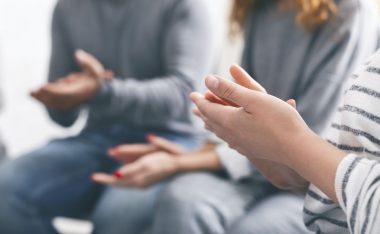 patients-clapping-hands-at-psychotherapy-session-close-up.jpg